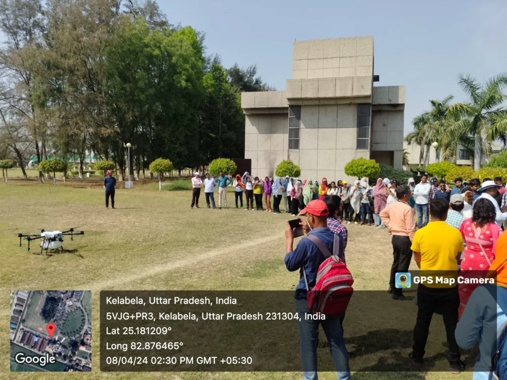 My journey: From Farming Fields to Digital Fields in 2025 10 ICAR–IIVR scientists demonstrating a drone pesticide spray to a group of students on the institute lawn
