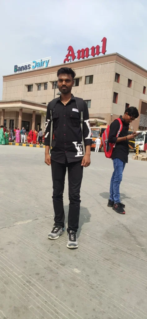 My journey: From Farming Fields to Digital Fields in 2025 6 Student (Akash Bhardwaj - founder of agriverses) standing in front of Banas Dairy plant in Varanasi during an educational visit.